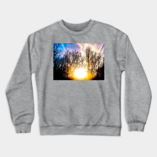 Sun setting behind trees Crewneck Sweatshirt